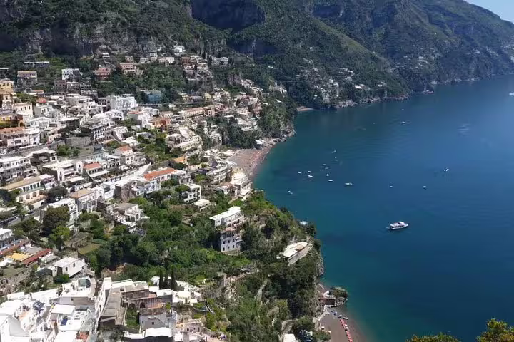 Panoramic view of colorful Positano cliffside houses and Amalfi Coast sea on a private full-day tour from Sorrento to Pompeii