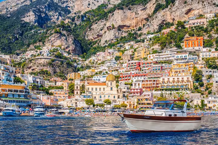 Scenic view of Positano's colorful cliffside buildings from the sea, a highlight of the Amalfi Coast boat tour from Naples.
