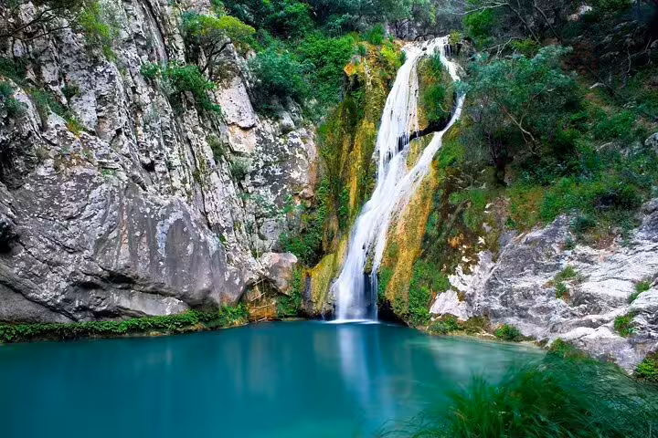 Waterfall and turquoise pool near Pozar Hot Baths, scenic nature stop on private Thessaloniki day trip