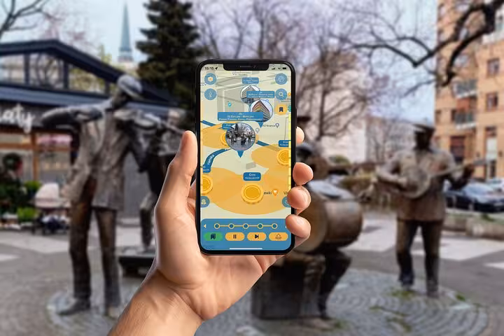 Hand holding smartphone with interactive Praga District walking tour app near bronze musician statues in Warsaw