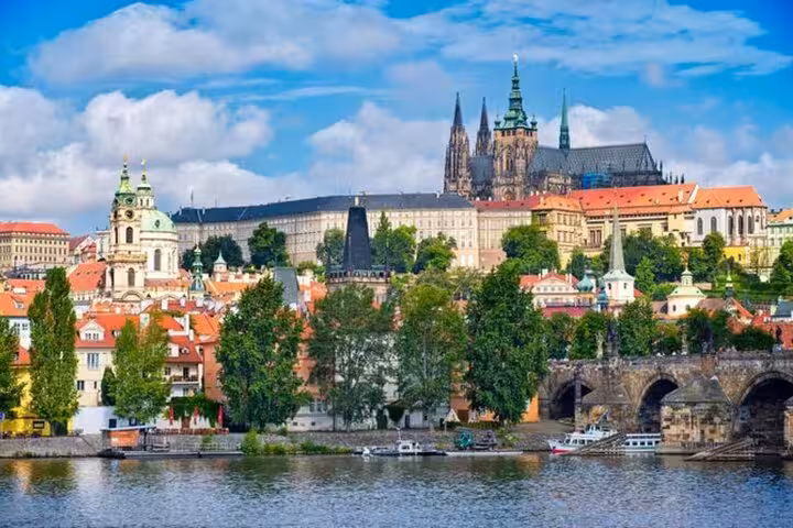 Prague Castle and St. Vitus Cathedral skyline over the Vltava River on a small-group day trip from Vienna