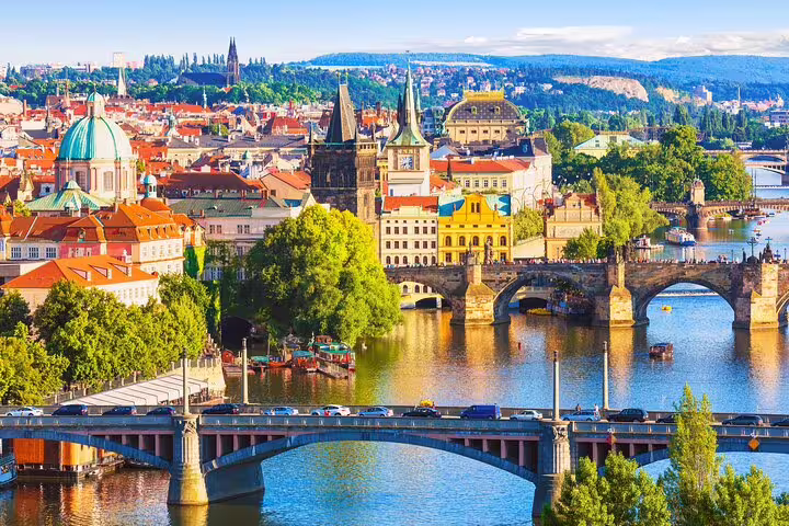 Aerial view of Prague's Charles Bridge and Vltava River with historic Old Town skyline