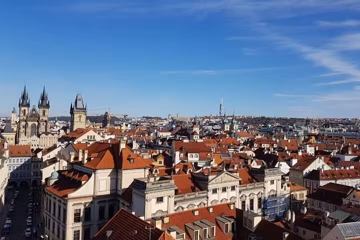 Panoramic Old Town Prague rooftops and church spires on a Vienna to Prague small-group day trip