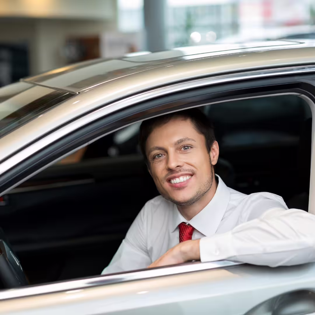Smiling chauffeur waiting in a premium vehicle ready for reliable Naples to Avellino or Avellino to Naples transfer