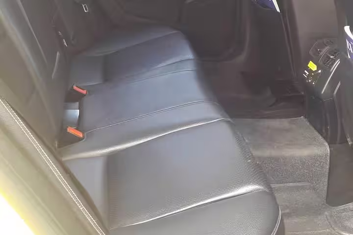 Spacious leather rear seats in premium sedan for private transfer from Athens to Nikiana Lefkada