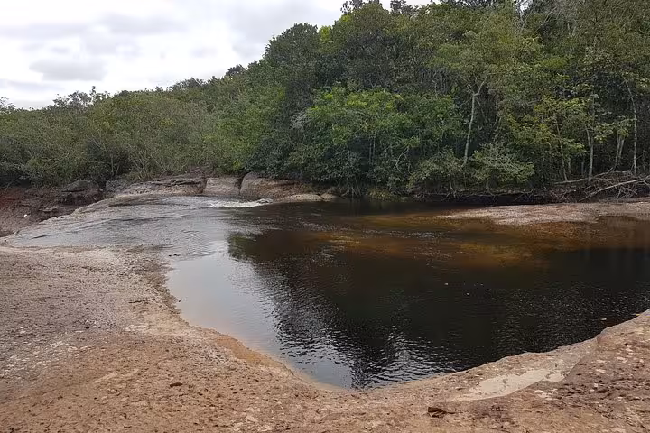 Natural river pool and rocky banks in Presidente Figueiredo, Amazonas, Brazil, on Amazon Waterfalls excursion