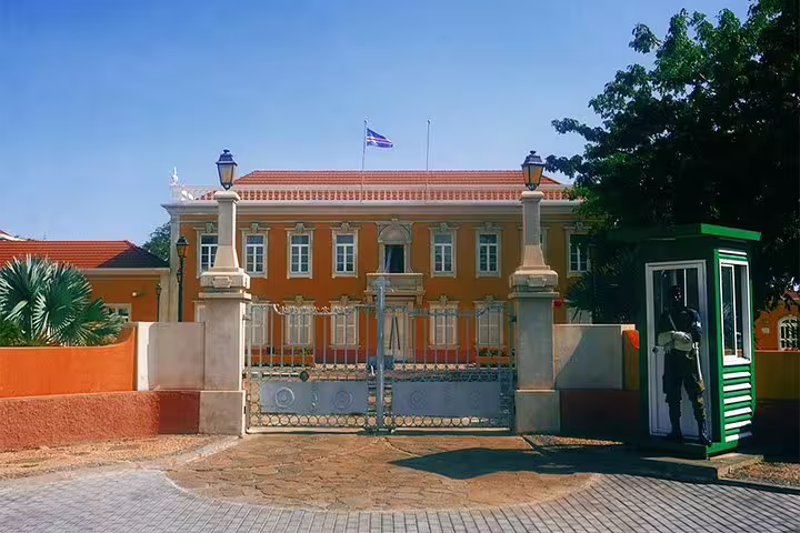 The Presidential Palace in Praia, Cape Verde, showcasing colonial architecture with a guardhouse at the entrance.