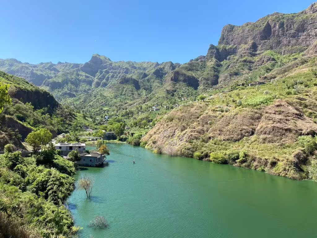 Scenic view of Principal Valley with turquoise river and rugged mountains, perfect for a Cape Verde hiking tour.