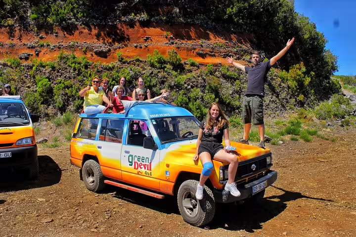 Group enjoying a thrilling full-day private 4x4 tour in West Madeira, surrounded by stunning landscapes and guided by a local expert.
