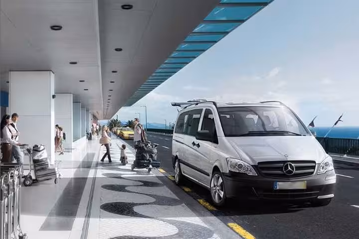 AC private van at Hurghada Airport curbside for hotel transfer with meet and greet luggage help