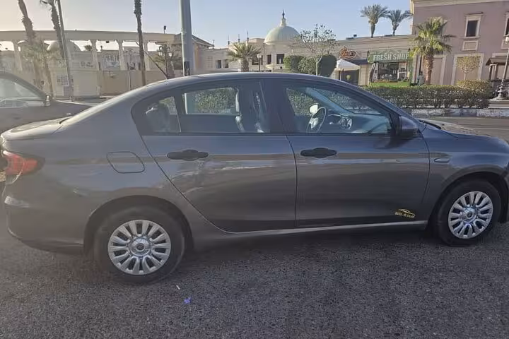 Side view of private taxi sedan in Sharm El Sheikh for airport pickup and hotel drop-off, Bebo transfer