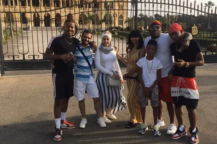 Group photo by Montaza Palace gates during a private historical guided Alexandria day trip from Cairo