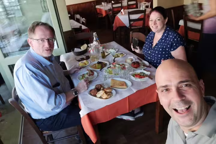 Guests enjoy Greek meze lunch during a private 2-hour Athens sightseeing tour with local guide
