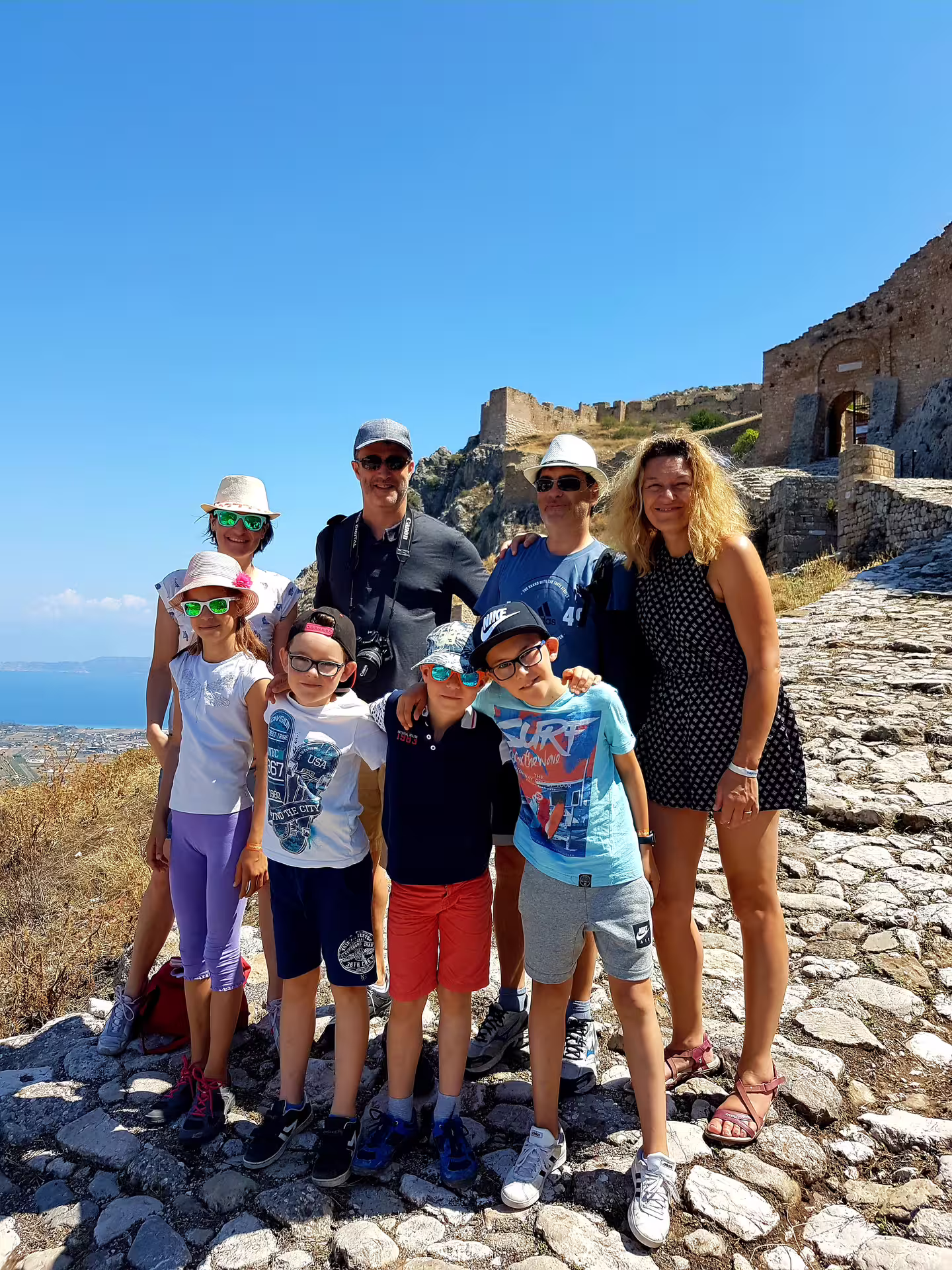 Group photo on Acrocorinth stone path, highlight of private biblical tour of Ancient Corinth from Athens