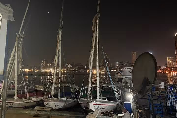 Nile River boats at night in Cairo marina, perfect setting for a private birthday dinner cruise with skyline views