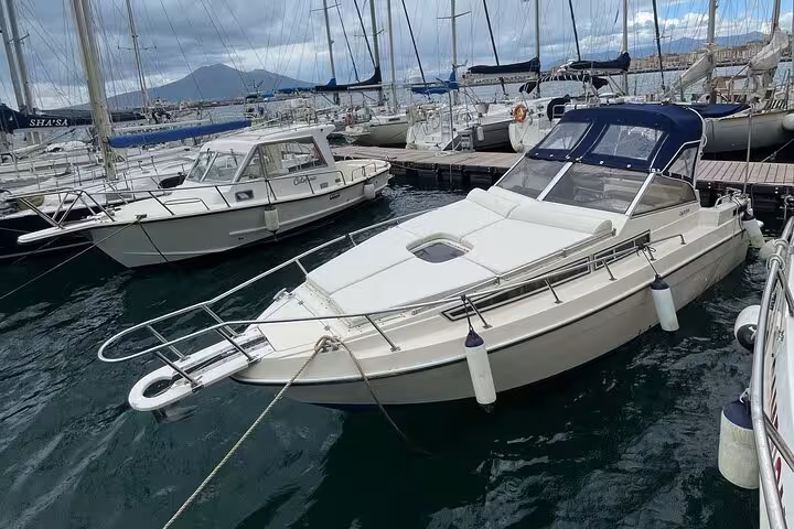 Elegant private boat docked at the marina, ready for a full-day Amalfi Coast exploration tour.