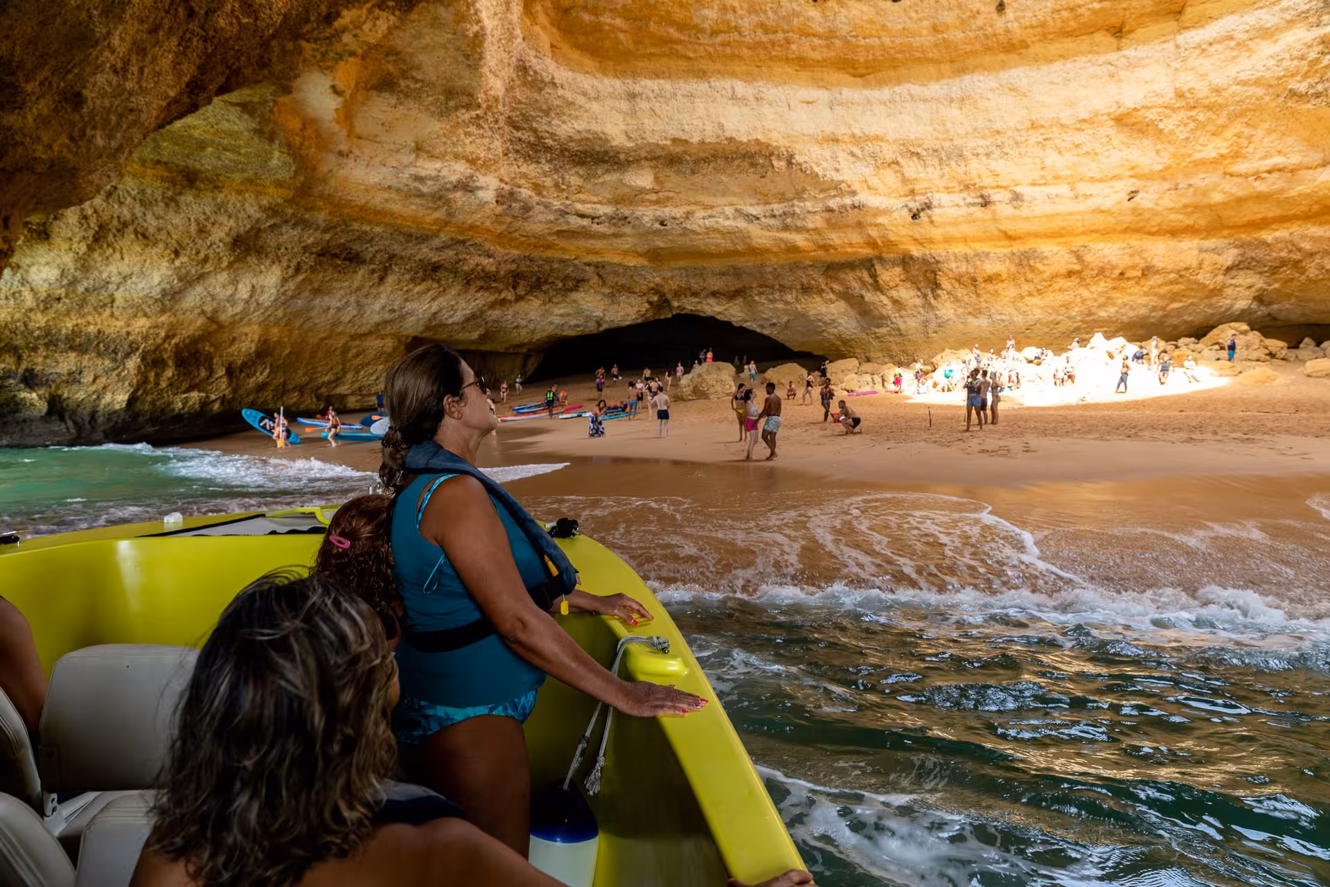 Guests on a private boat experience the awe-inspiring Benagil Cave, with its unique rock formations and golden sands.
