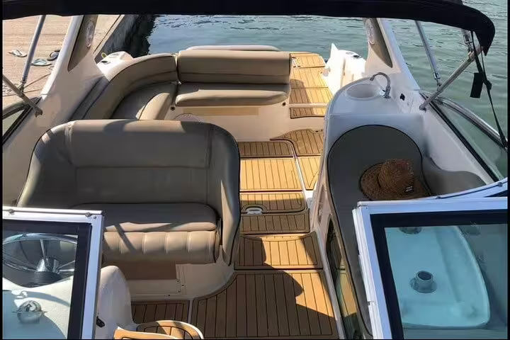 Spacious and stylish seating area on a private boat in Rio, perfect for a relaxing tour with barbecue and drinks.