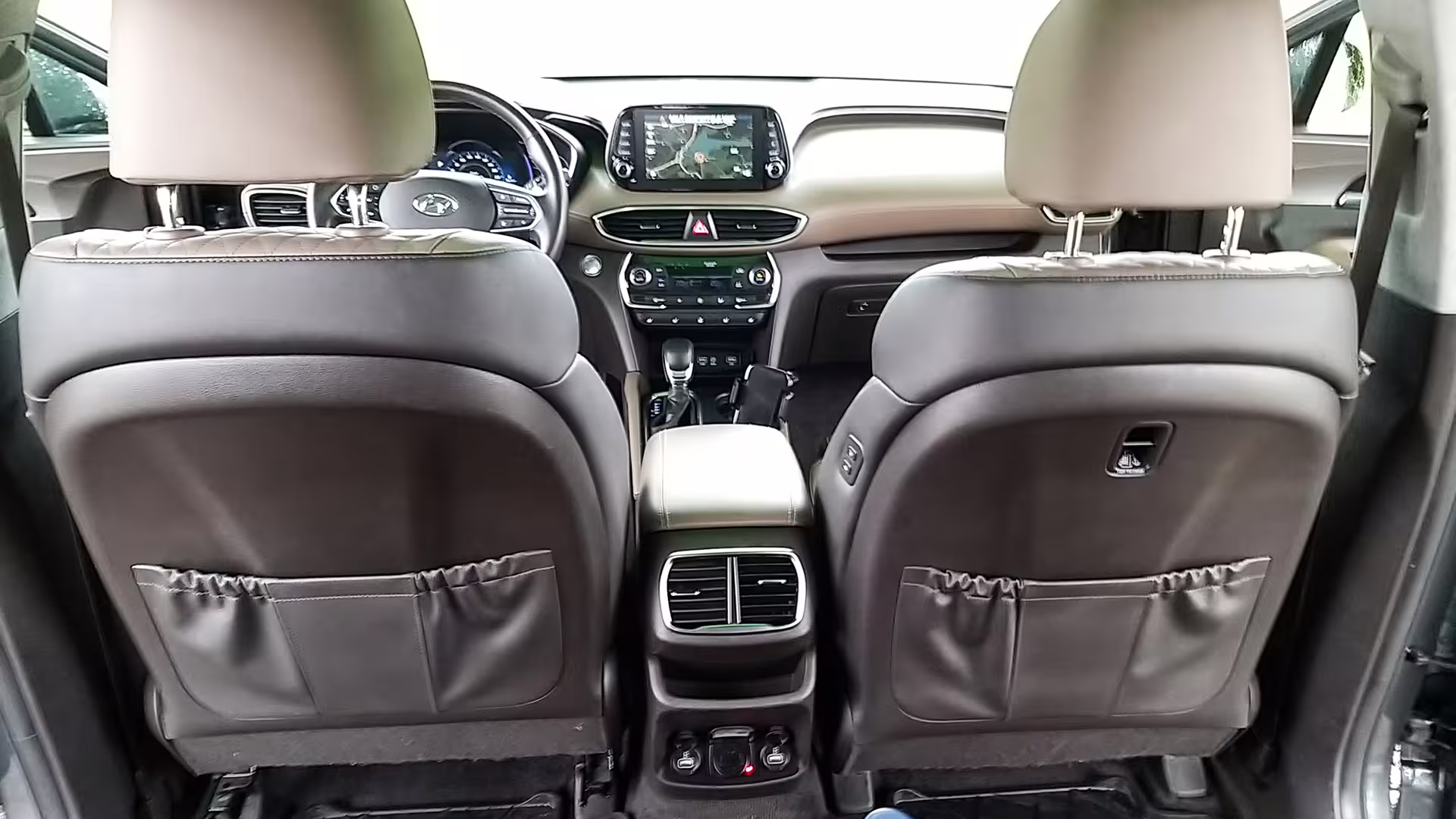 Modern car interior featuring GPS navigation for private transfer from Porto to Tomar.