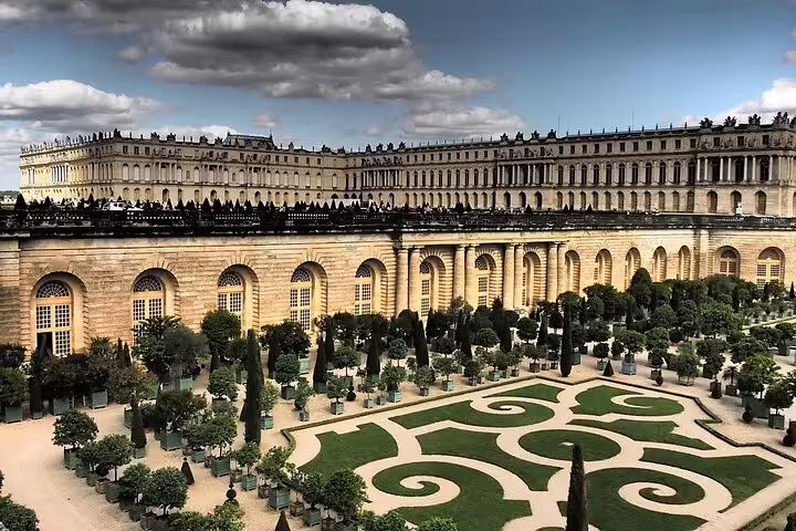 Private chauffeur car parked curbside, comfortable two-way transfer from Paris to Palace of Versailles and return