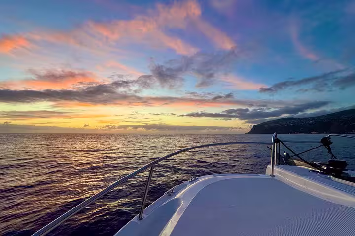 Serene private cruise at twilight with vibrant skies and stunning ocean views, ideal for sunset getaways.