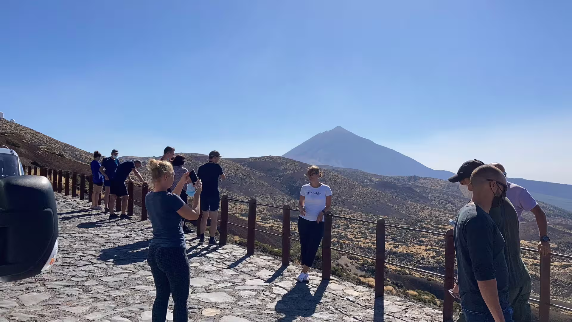 Visitors enjoying scenic views of Mount Teide from a vantage point on a private cruise tour.