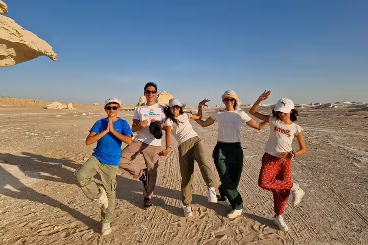 Group posing on a 4x4 desert safari in Egypt’s White Desert, part of a private day tour to Bahariya Oasis