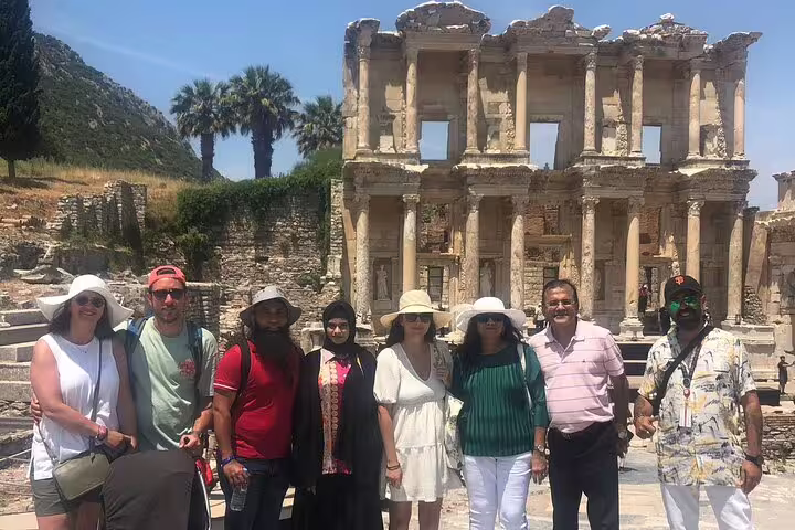 Tour group posing in front of the iconic Library of Celsus during a private Ephesus tour from Izmir.