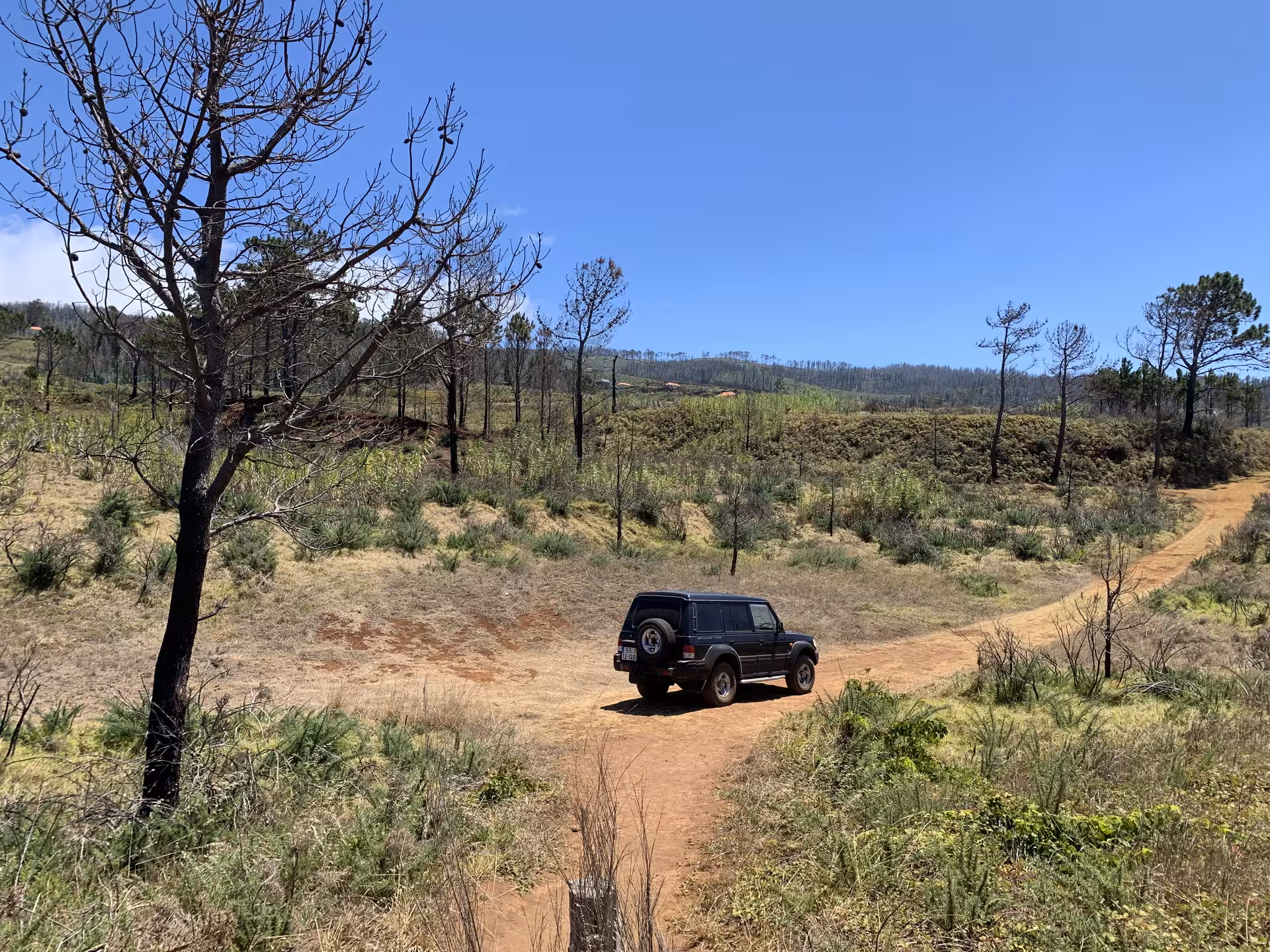 Private guided 4x4 jeep tour navigating rugged off-road dirt trails through Madeira's scenic landscape