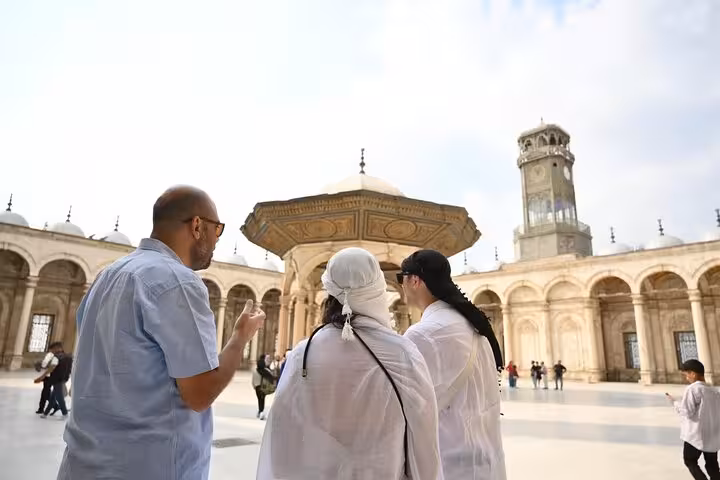 Private guided Cairo tour group exploring the Citadel courtyard with historic mosque architecture and minaret