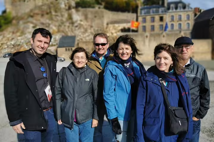 Small group with guide in Mont Saint-Michel village, private guided day trip from Paris in Normandy