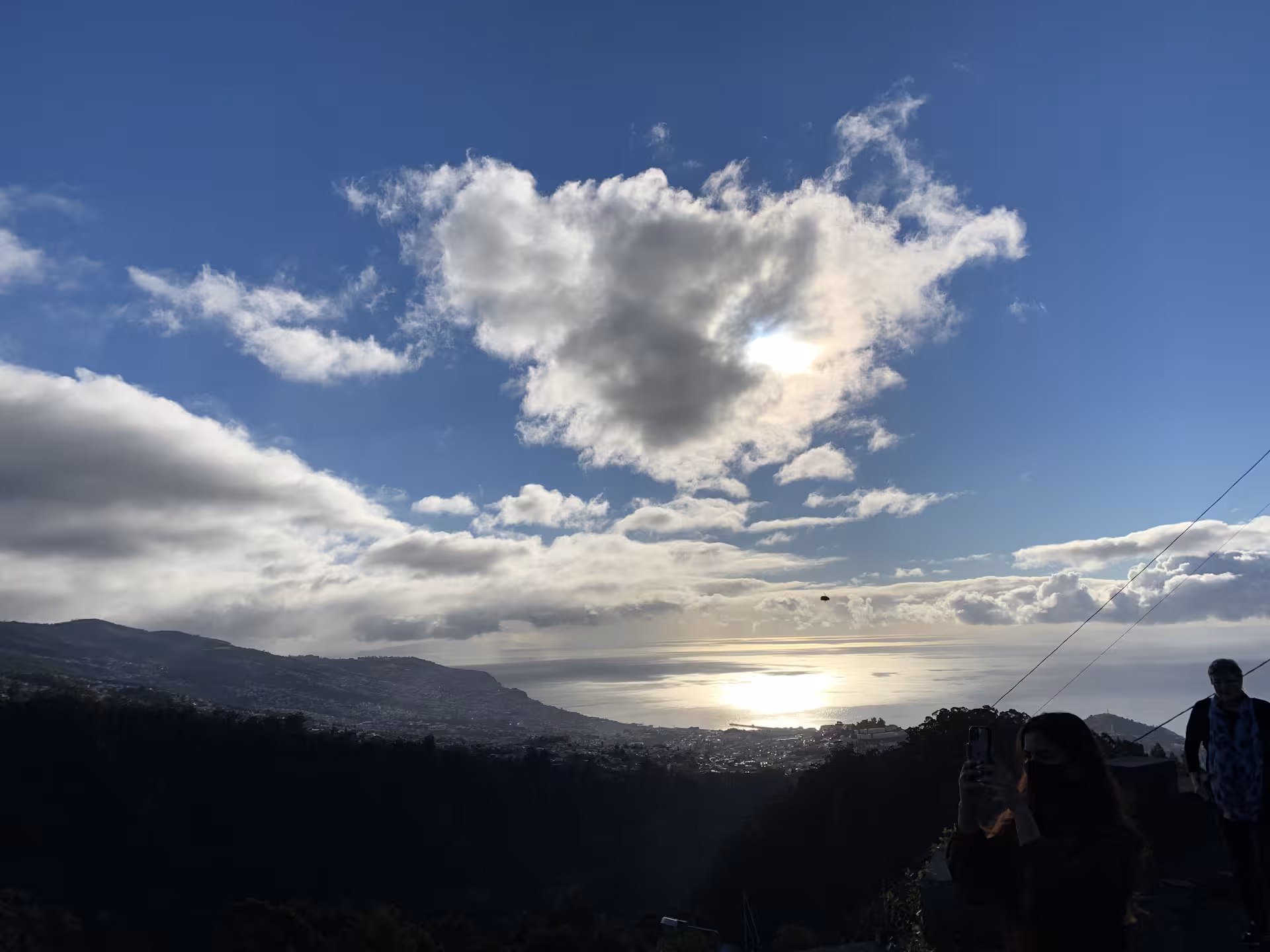 Private guided small group tour enjoying a breathtaking panoramic sunset view over the ocean and mountains