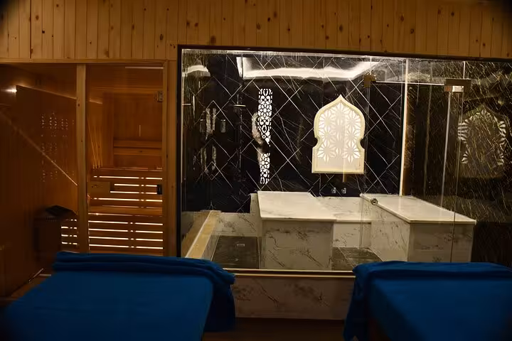 Private hammam room in Sharm El Sheikh spa with marble bath, sauna door, and relaxing loungers