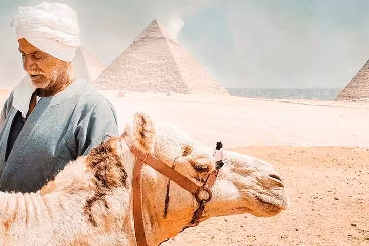 Local guide with camel and Giza Pyramids backdrop on a private Hurghada to Cairo pyramids tour