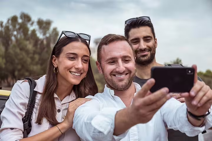 Happy tourists taking a selfie during a memorable private sightseeing tour in scenic Istanbul.