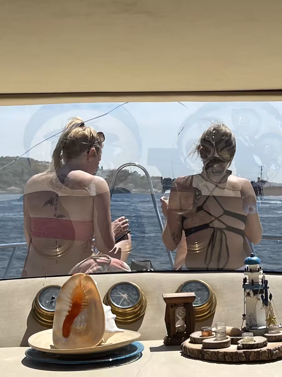 Guests relax on a private Istanbul yacht, enjoying sea views before a Bosphorus swimming stop in summer