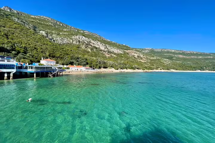 Explore the stunning turquoise waters and scenic coastline of Arrábida, Sesimbra on a private 4x4 Jeep beach picnic tour.