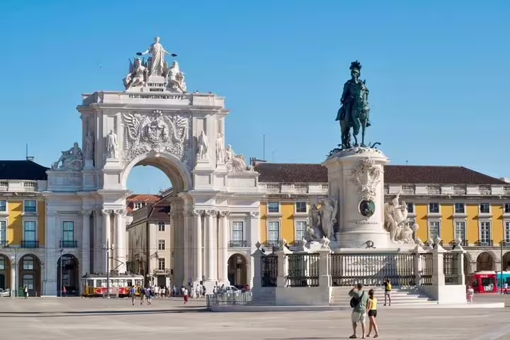 Arco da Rua Augusta and King José I statue in Lisbon's Praça do Comércio, perfect for a private city tour exploration.