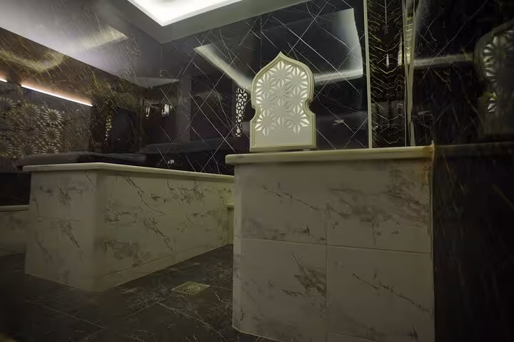 Luxury private hammam room in Sharm El Sheikh spa with marble slabs and ambient lighting for privacy