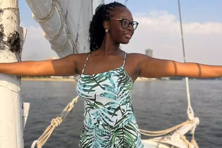 Guest posing on deck during a private Nile birthday celebration cruise in Cairo with lunch or dinner option
