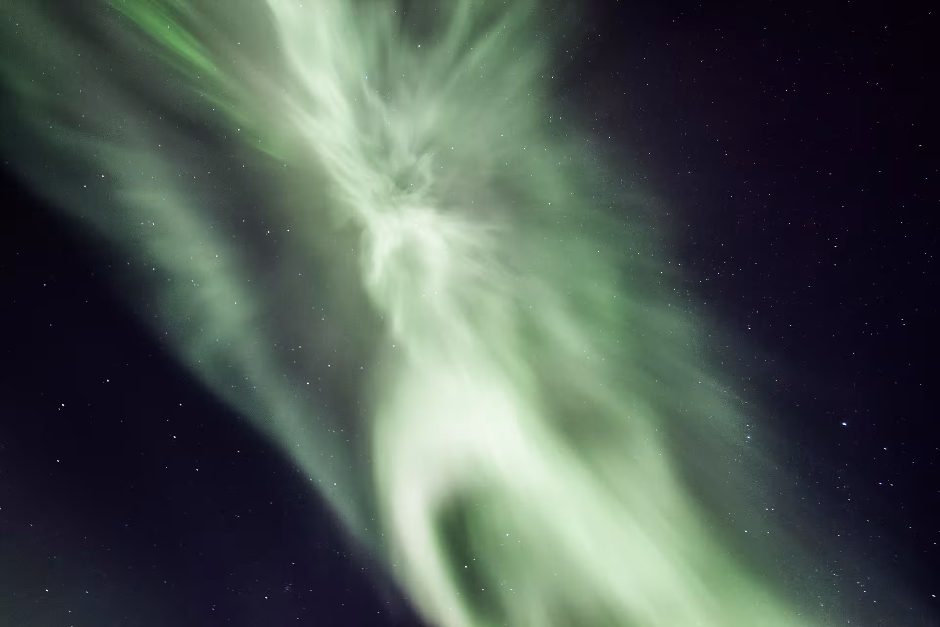 Stunning display of the Northern Lights against a starry sky, ideal for private aurora viewing experience.