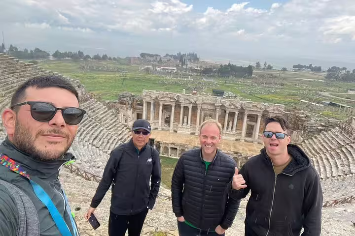 Small group enjoying views of historic ruins on a private Pamukkale tour from Kusadasi Port.