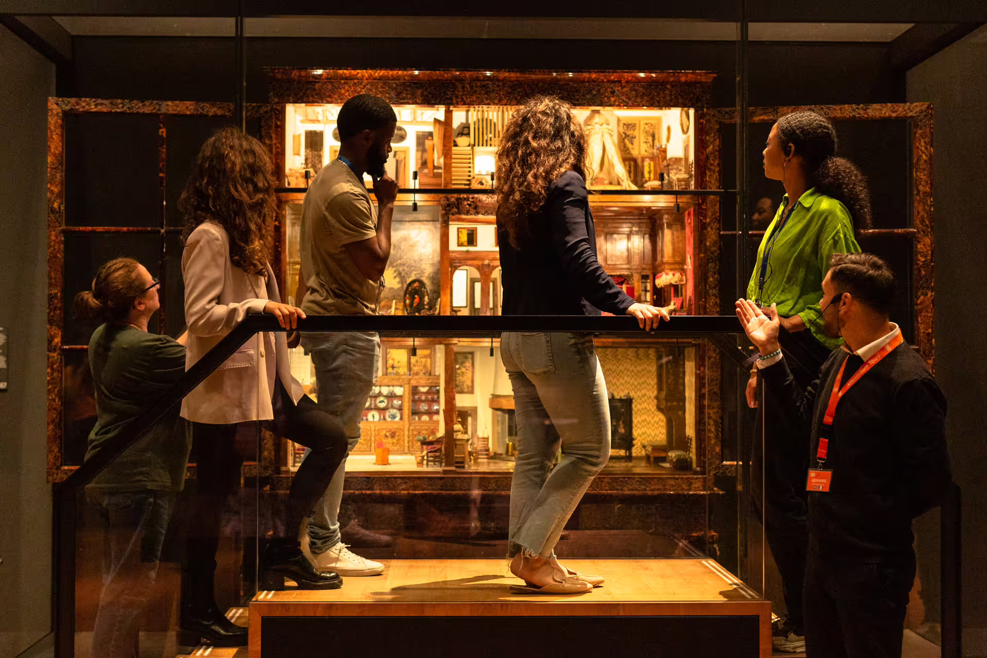 Visitors engaged in a private Rijksmuseum guided tour, exploring intricate exhibits with a knowledgeable guide.