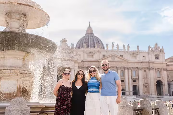 Group photo at St Peter’s Square with fountain and basilica, captured by a private Rome travel photographer
