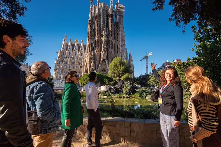 A guide explains the history of the Sagrada Familia to a group during a private skip-the-line tour in Barcelona.