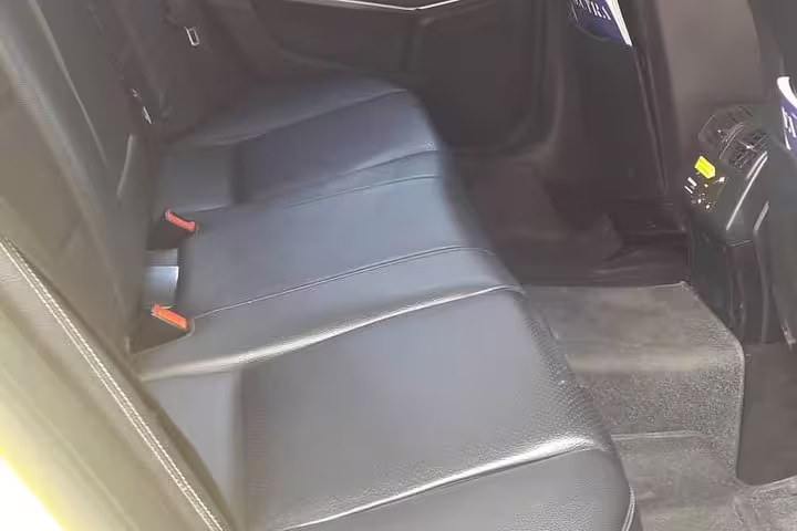 Spacious leather rear seats in private sedan for Ancient Olympia to Athens transfer with comfortable long-distance ride