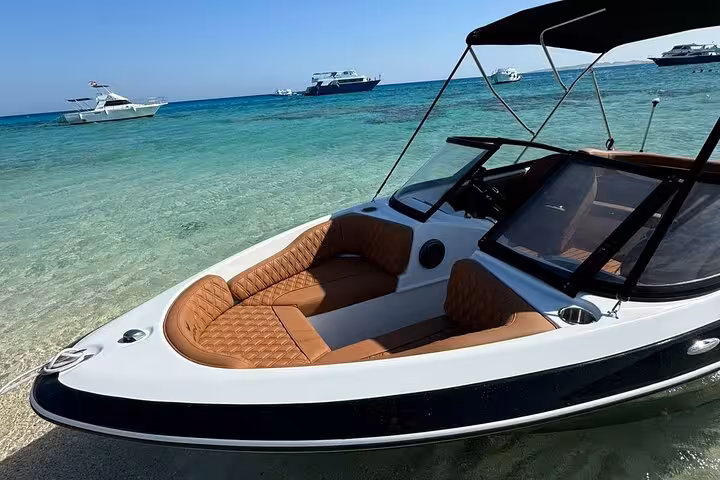 Private speedboat seating and deck at Magawish Island beach, Hurghada snorkeling tour in Red Sea