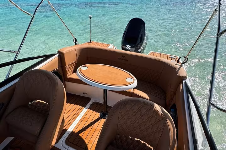 Luxury private speedboat seating on clear Red Sea waters on Orange Island snorkeling trip from Hurghada