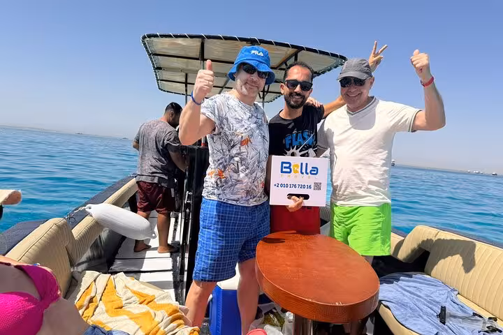 Guests posing on private speedboat in Hurghada before Orange Bay Island snorkeling tour on the Red Sea
