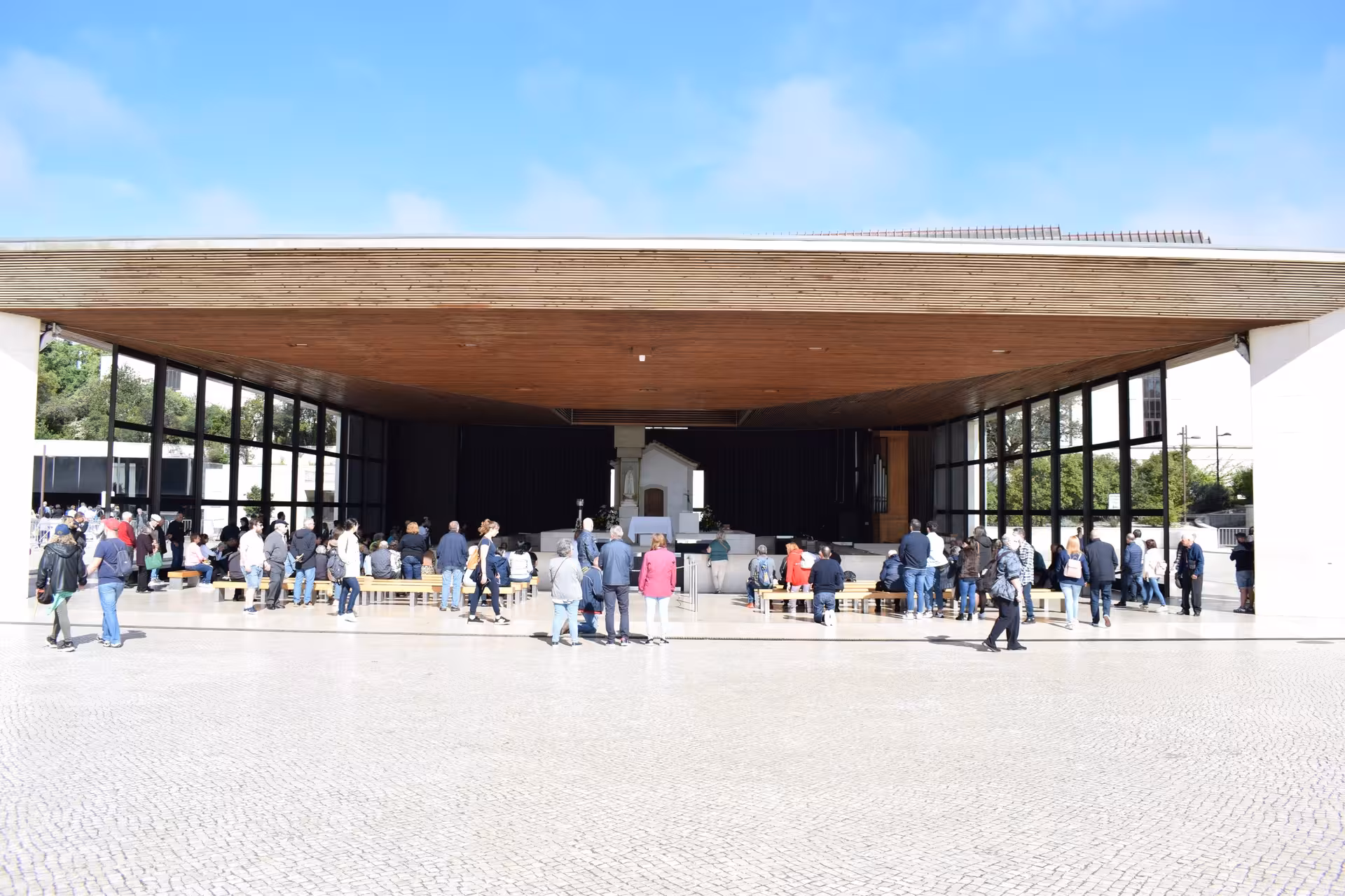 Pilgrims gathered at the Chapel of Apparitions in Fátima, stop on a private Fátima and Coimbra day tour with lunch